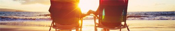 cuple holding hands at sunset